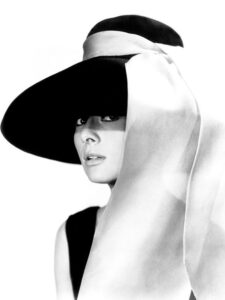 Audrey Hepburn wearing a classy hat